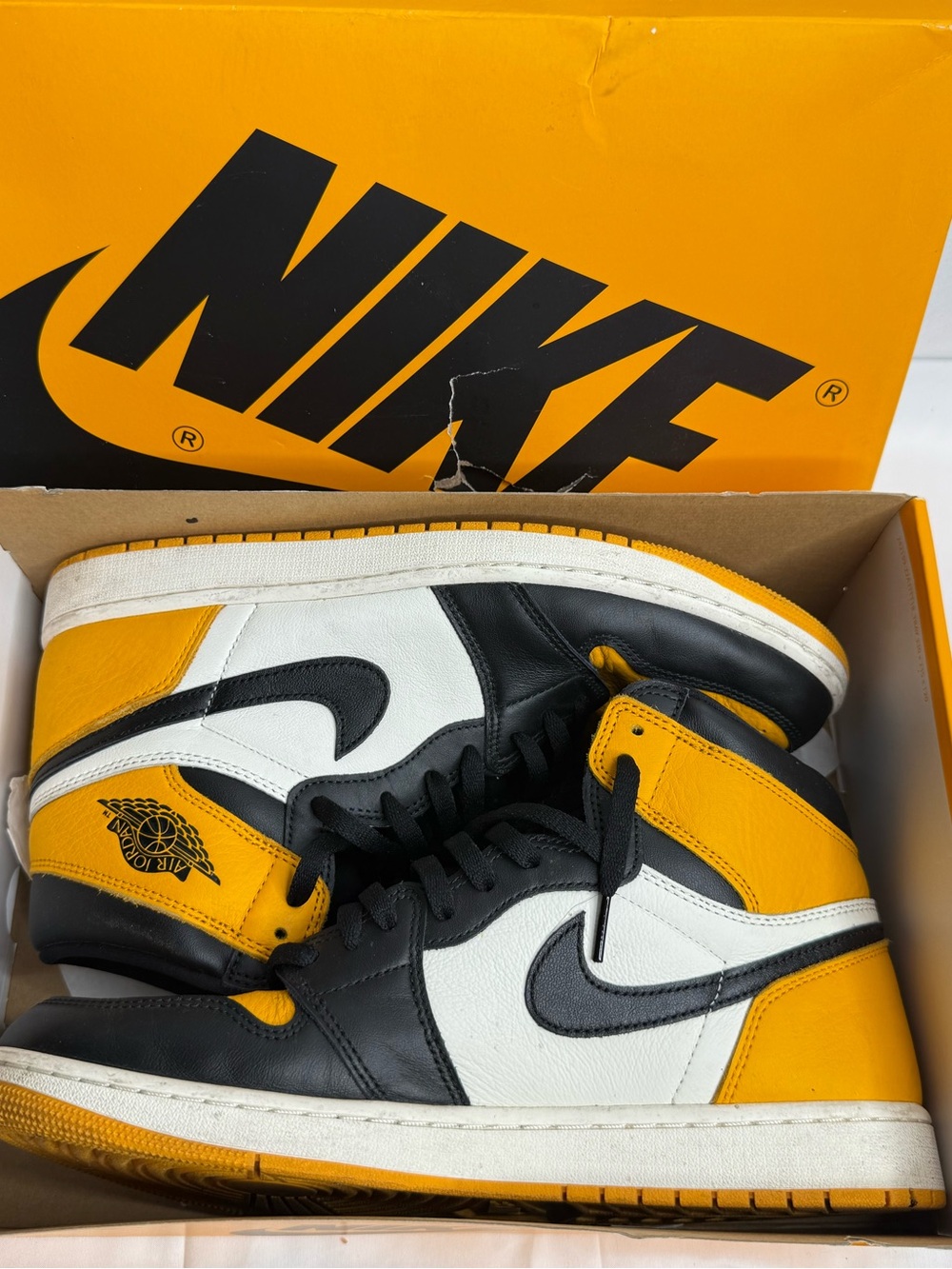 Air Jordan 1 Retro High OG "Taxi" sneakers in a classic yellow, white, and black